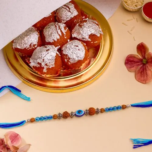 Unique Evil Eye Rakhi N Ghee Laddu Delight 1
